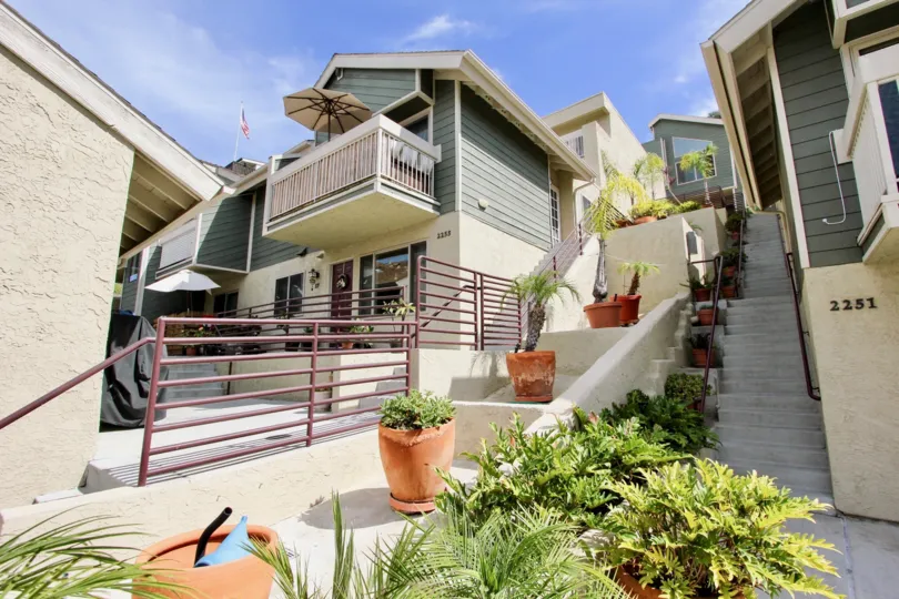 Residential landscaping and staircases with plants on levels.
