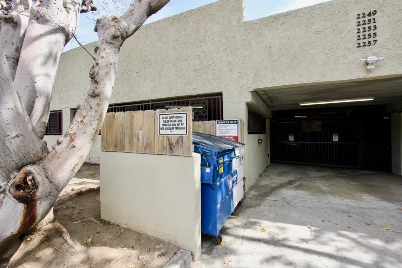 Gray building with a garbage collector in Bay Pointe neighborhood