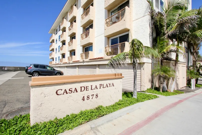 An apartment complex displaying huge parking space at Casa De La Playa