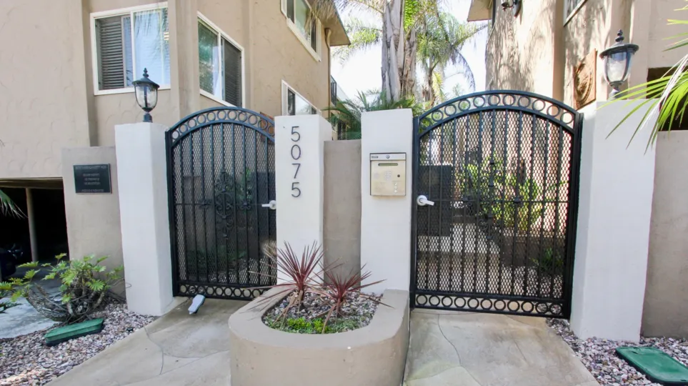 Two separate gates between two houses, located in Casa Marina, Ocean Beach, California.