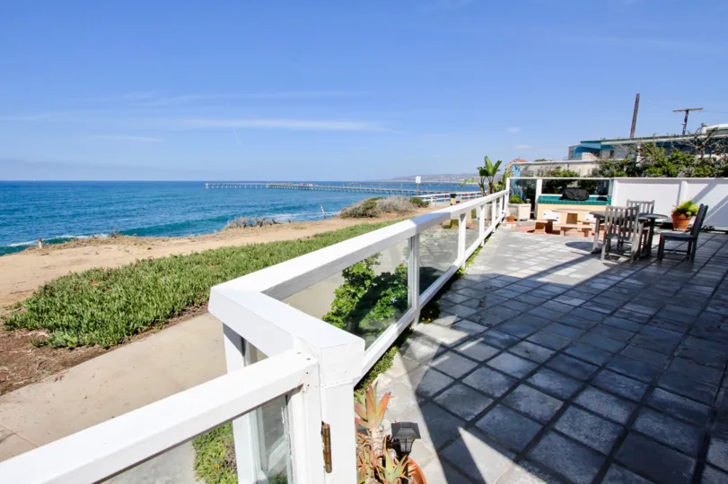 A sunny day in the Cliff House with a beach and the dinning tables at Ocean Beach California