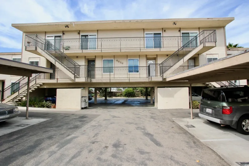 Covered parking and stairways leading to the Loma Dunes properties in Ocean Beach, California