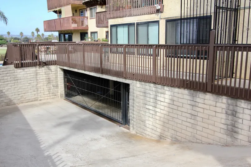 An underground parking to townhouses in the Loma Pacific community with brown terraces.