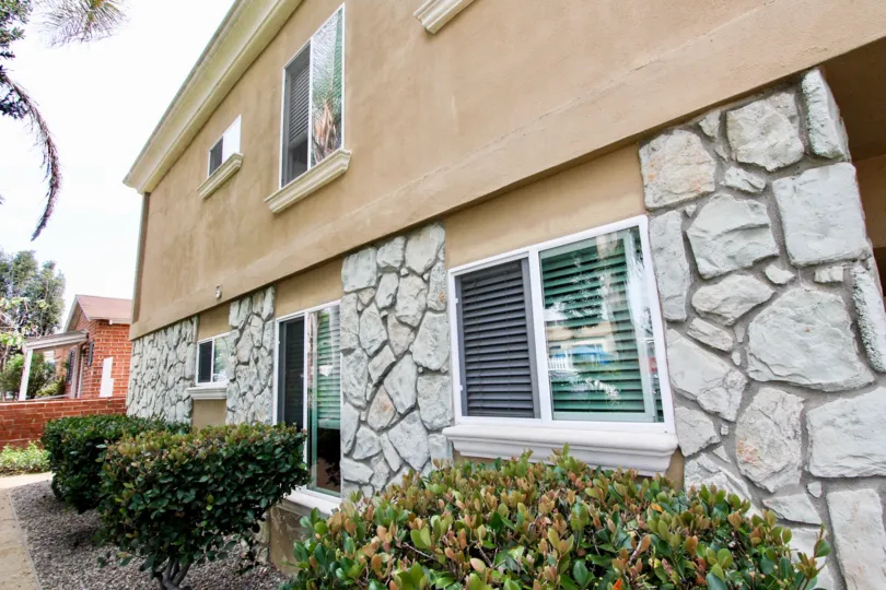 A building on a corner in the Mentone Villas area of Ocean Beach has rock walls.