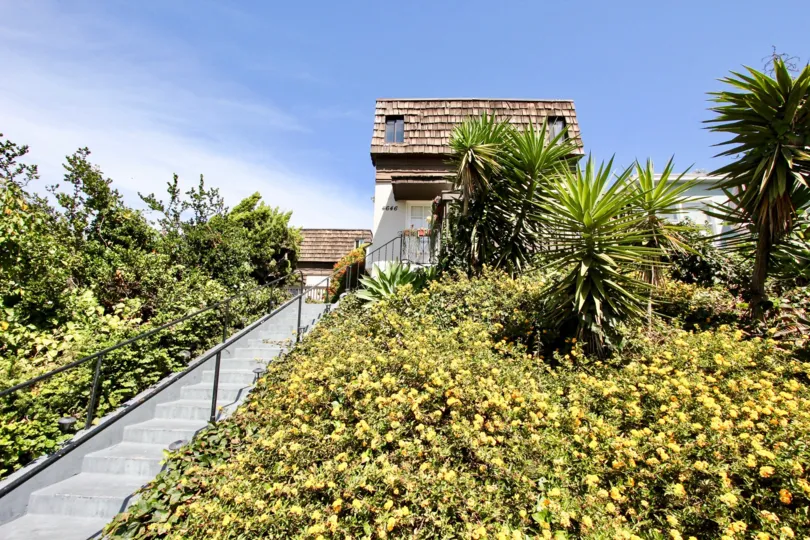 A house with brown shingles in the Narragansett Villas community of Ocean Beach CA.