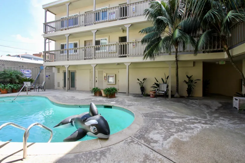 Keep an eye on the kids playing in the pool from your front door at Oceanus.