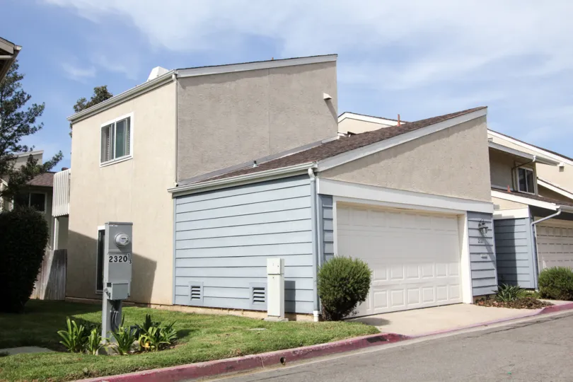 A slanted structured home is on the corner in Park Point Loma an Ocean Beach, CA community.