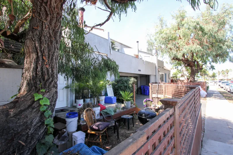 Outdoor furniture and potted plants in the Park Regent community of Ocean Beach, California.