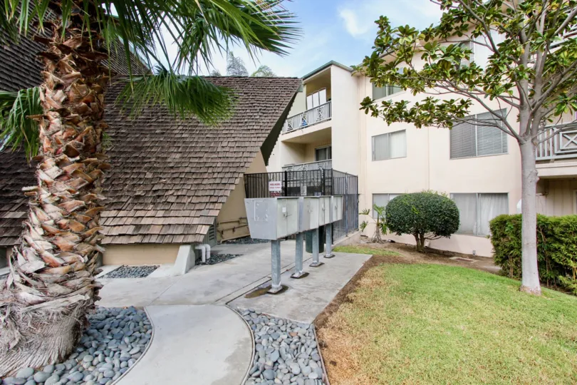 Garden decorated with plants and trees around the building in Point Loma Villas