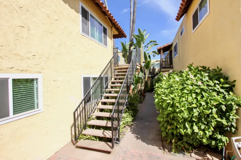 Under the Stair outside that are way to the villa has bushes and plants