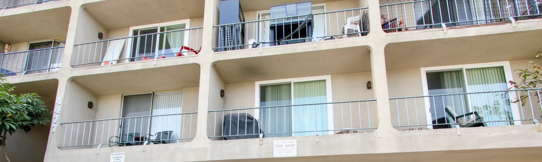 Cozy balconies with privacy walls and iron railings with ample lighting at Sans Souci