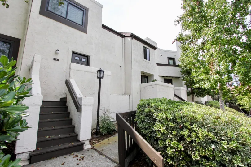 Contemporary earth tone color exterior and well kept landscaping features at Sea Colony