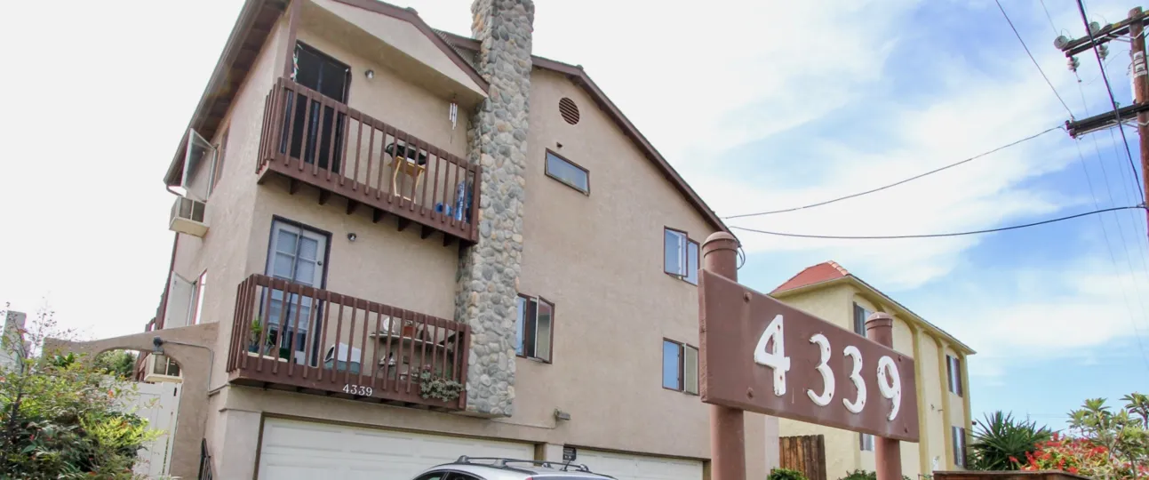 Building 4339 is brown and tan in the Tangerine Tree community of Ocean Beach, CA.