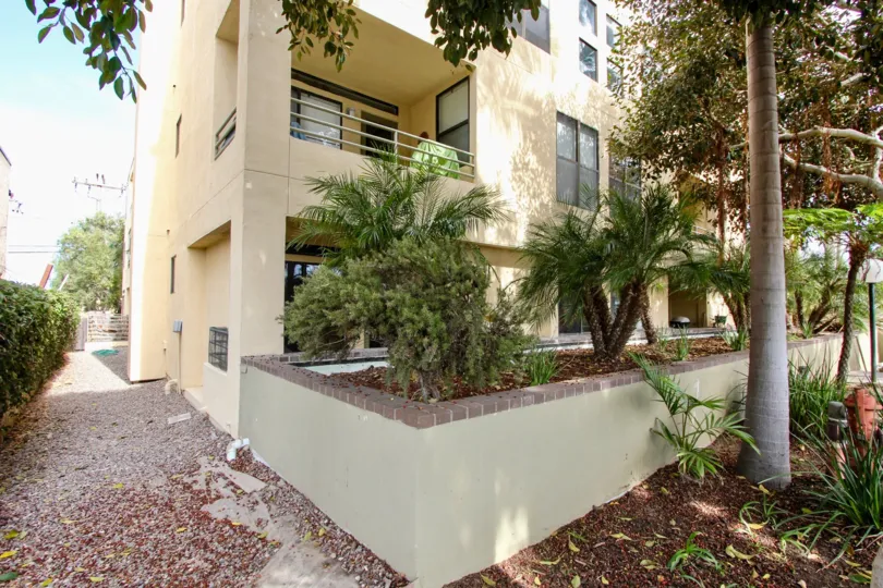 Side view of the building with trees and plants in Vantage Point