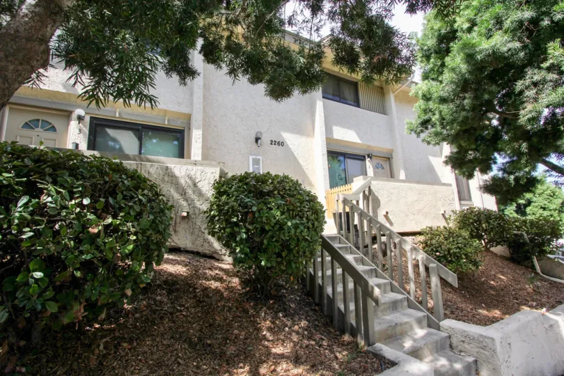 front view for the building with trees and plants in Worden Street Condos