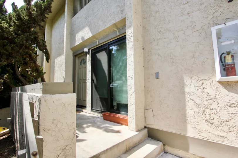 A side view of the white stucco buildings in the Worden Street Condos area of Ocean beach CA
