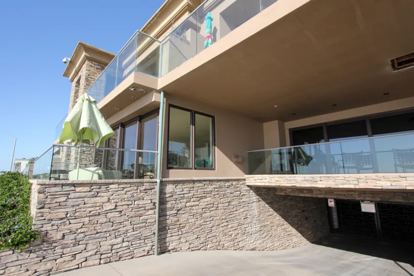 The Strand, Oceanside, California, stone wall, blue sky