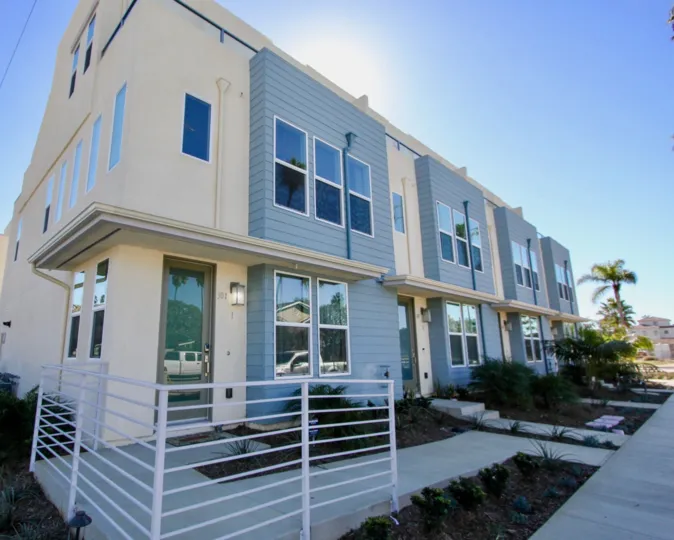 Beachwalk at Cassidy, Oceanside, blue sky, glass windows, California