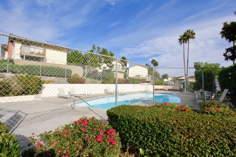 El Camino Club Estates, City: Oceanside, fencing and plants near swimming pool