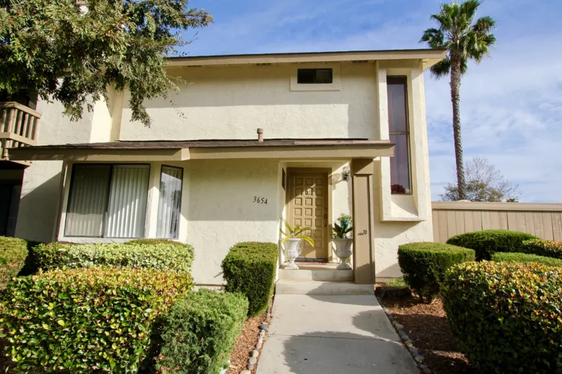 This lovely building sits in the sun with palm trees flanking it in Oceanside, California