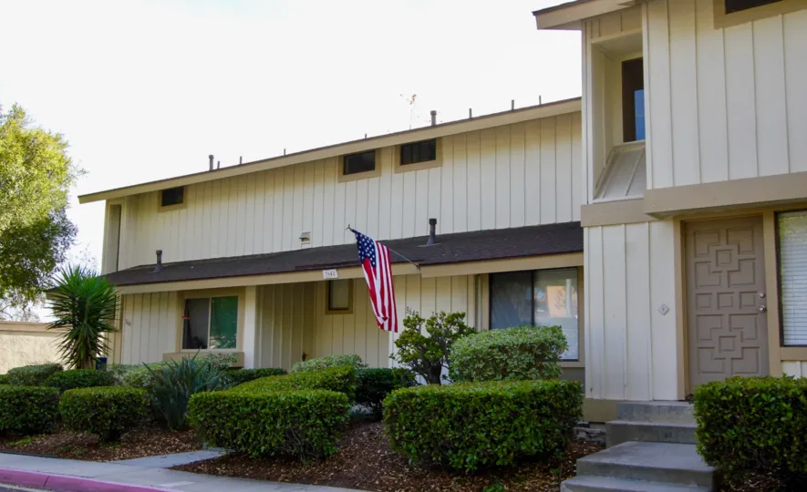A calm and sunny day at The El Camino Club Estates With a view of the well-kept and beautifully tended hedges and garden and the entrance