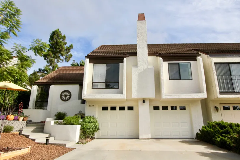 House with double garage and chimney in El Camino Villa, Oceanside, California