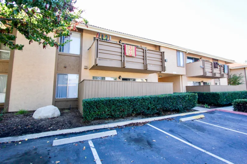 This apartment building sits with leaves falling in front of it in Oceanside, California