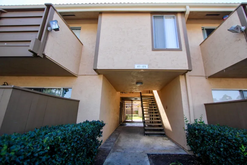 A sunny day in the area of Forest Glen, stairway, window, light, buches, outside, condo