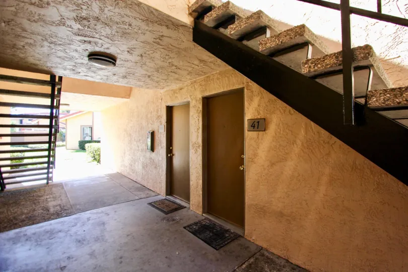 Apartment #41, located near stairs, door mat at the door
