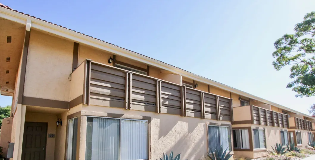 Windows and desert plants in front of units at Forest Glen in Oceanside, CA