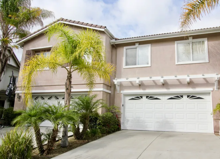 A wide exterior shot of a home in the Ivey Pointe community in Oceanside California