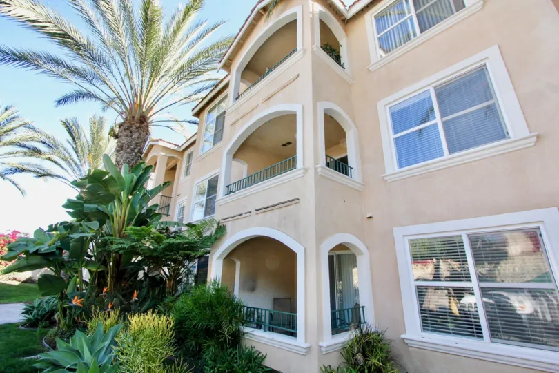 blue sky big house and green palm trees in La Costa Villas