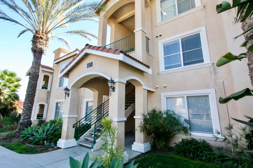An attractive house in the La Costas Villas community with palm tree
