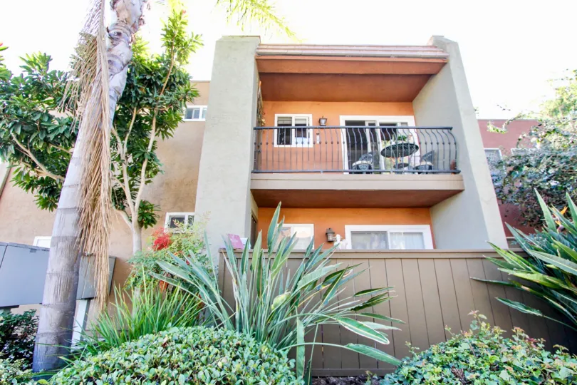 Balcony overlooking shrubbery at La Estancia in Oceanside, CA