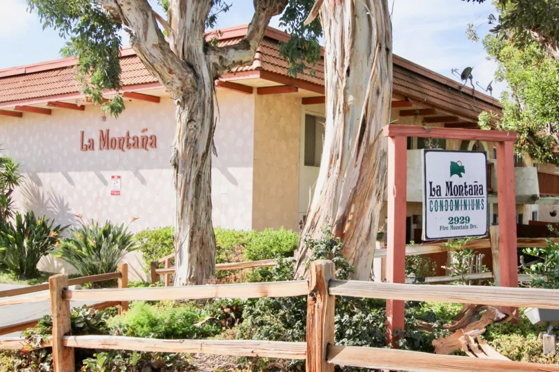 Spanish influenced condominium housing with premium landscaping at La Montana in Oceanside, CA