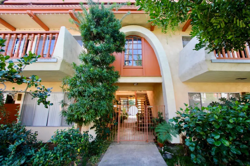 A sunny day in the area of La Montana, gated entrance, outside, plants, balcony