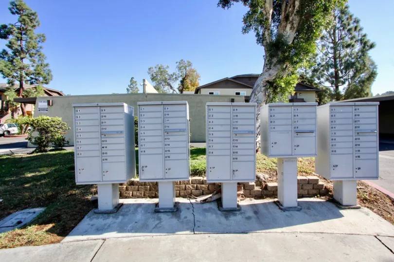 In the lakeshore villas Community white mailboxes line the sidewalk.