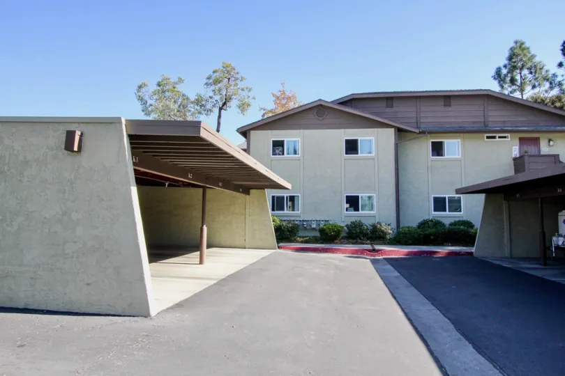 A sunny day in the area of Lakeshore Villas, outside, carport, condo, parking lot, window