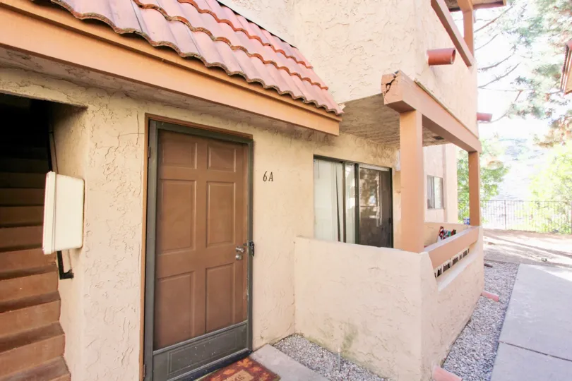 A porch by the doorway of a unit in Loma Alta Village in Oceanside, CA
