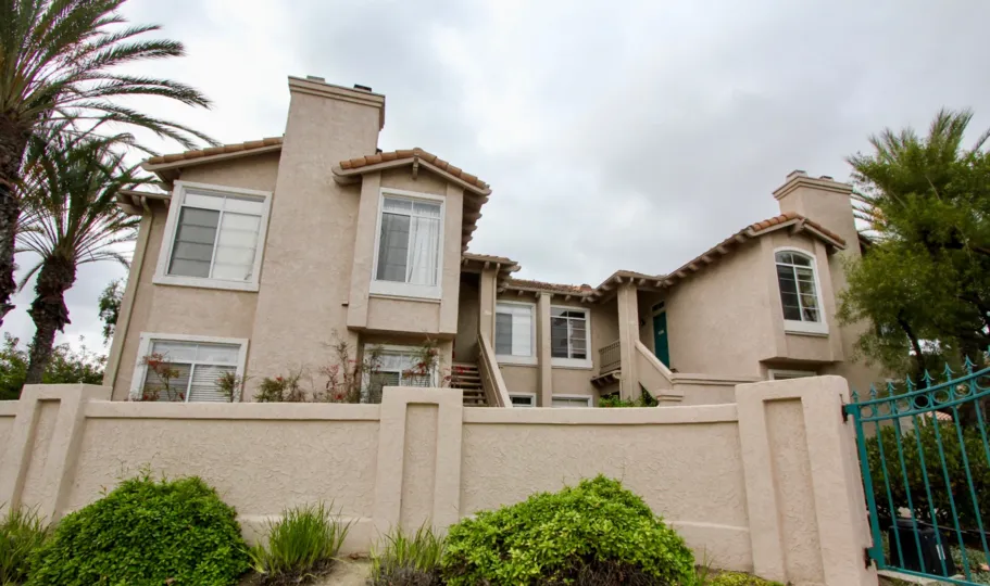 Condo town homes behind a security wall at Lomas De Oro in Oceanside CA