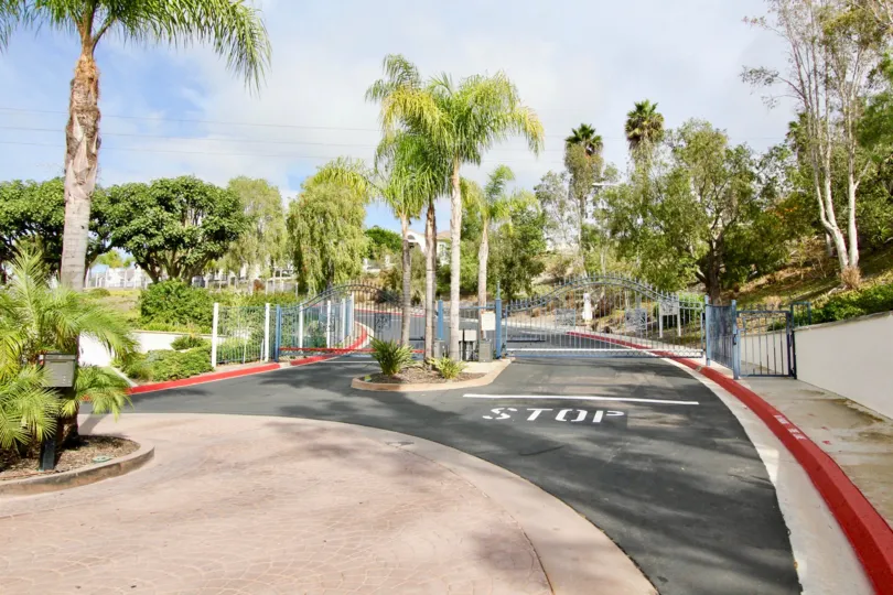A gated community with entrance with a STOP signal showing both Entrance and Exit at Mission Del Oro