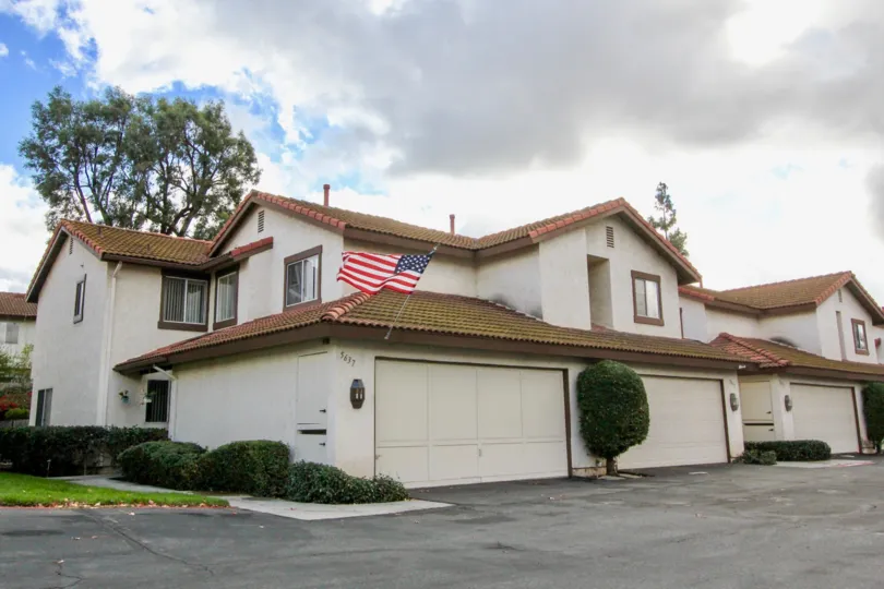 THE HOUSE IN THE MISSION MEADOWS WITH NATIONAL FLAG OF USA, PLANTS.