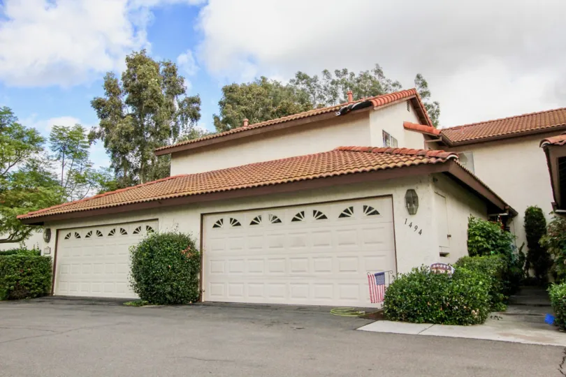 A home with nice tiled roof, extended, two door, garage, in Oceanside California.