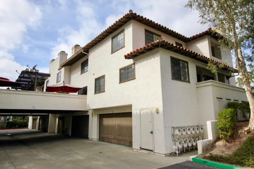 Spanish style Mission Point townhome residence with garage door and overhang in Oceanside California