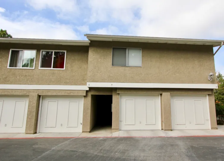 Ethnic textured out side walls with matching color to doors in Mission View.