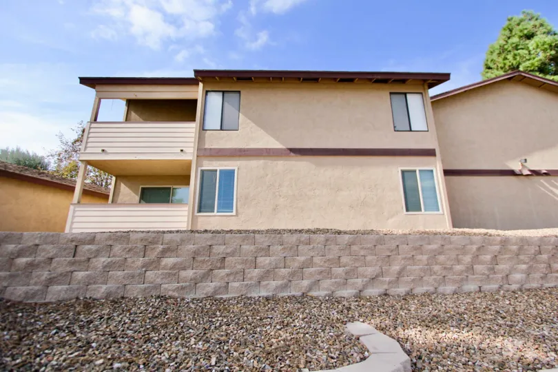 A gravel bed in front of a short wall at Mission Vista in Oceanside, CA