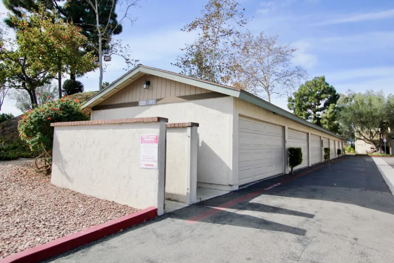 Double car attached garages in a wide back lane at Mission Vista in Oceanside, CA