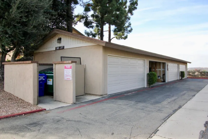 Garages and a dumpster at Mission Vista in Oceanside, CA