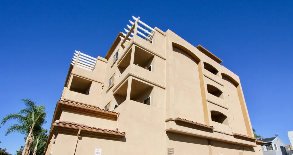 This gorgeous building sits overlooking the palm trees in the Oceanside Sun