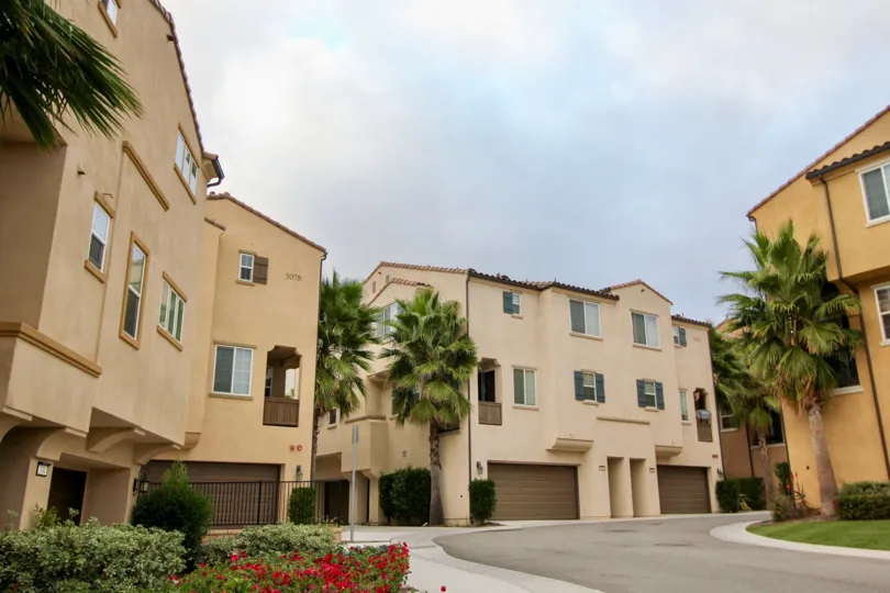 A sunny day in the area of North River Village, outside, condos, garage, window, palm trees
